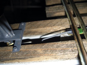 The spring wire connects the switch stand to the throw bar of the switch.